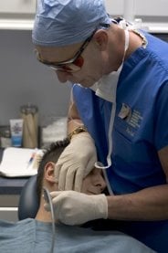 doctor  while doing a surgery on a patient